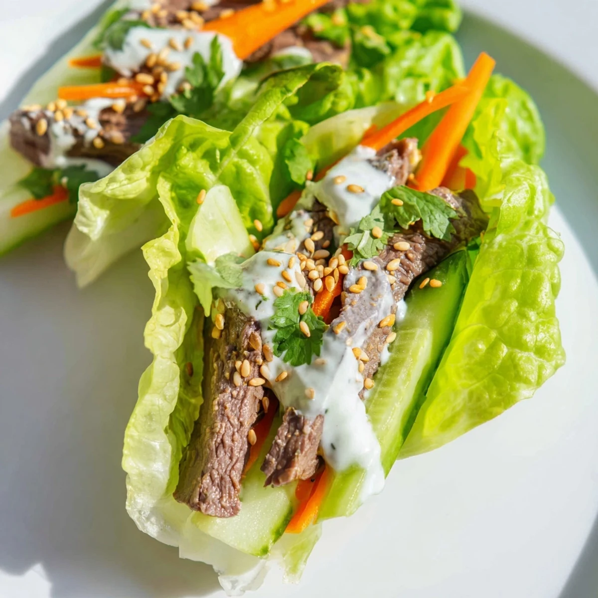 Inside a Beef Wrap with Lettuce, julienned carrots, cucumber, and fresh cilantro provide a colorful, appetizing crunch.
