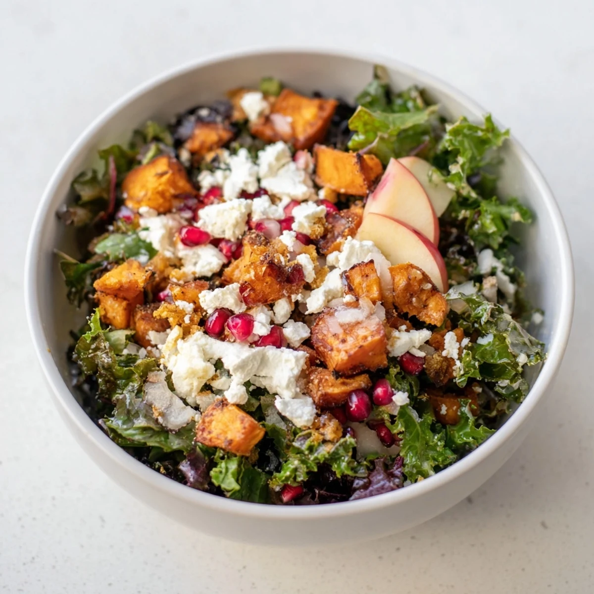 This hearty Winter Salad Mix presents tender roasted sweet potatoes, beets, and carrots on a bed of kale and arugula.