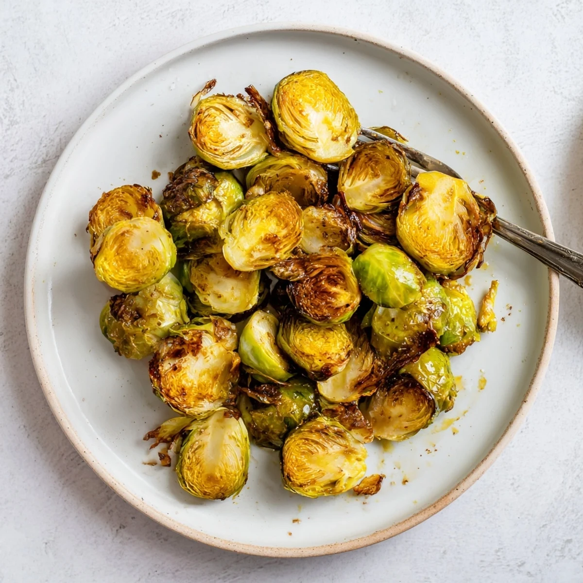 Roasted Brussels Sprouts with Honey tossed in olive oil and finished with a drizzle of honey.