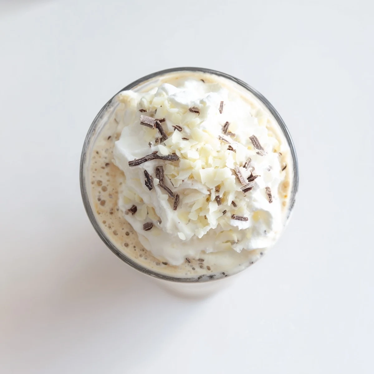 A frosty Vanilla Bean Frappuccino is blended with ice, milk, and real vanilla bean seeds.  