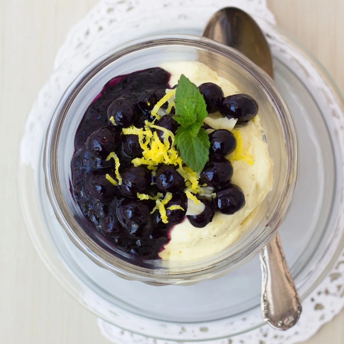 Elegant Lemon Blueberry Mousse served in clear glasses with fresh blueberries and mint, ready to enjoy.