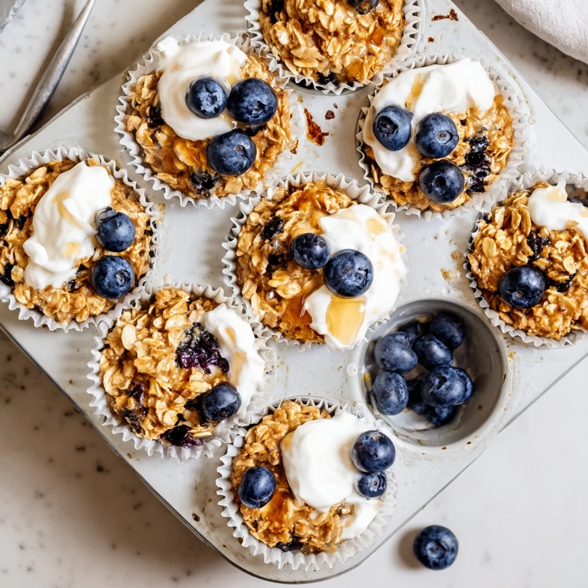 These healthy Baked Oatmeal Cups with Greek Yogurt are a grab-and-go breakfast.