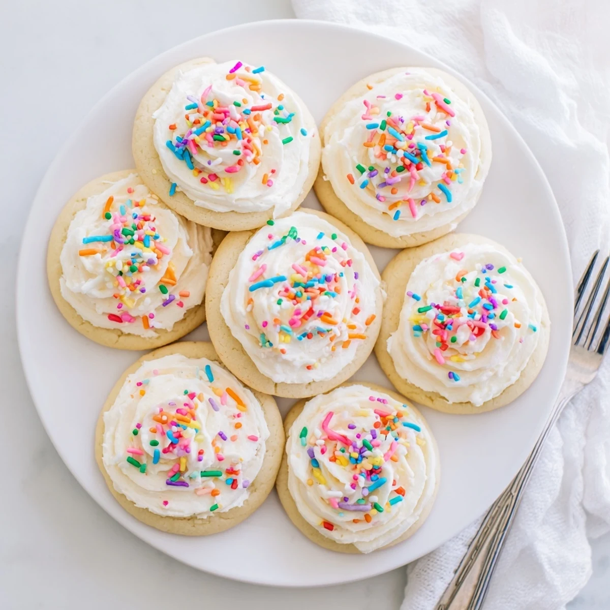 Close-up of Walmart-Style Sugar Cookies with Buttercream Frosting, highlighting creamy vanilla buttercream texture and perfectly round bakery-style shape.