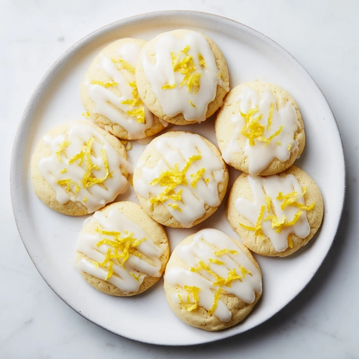 Limoncello Cookies arranged on a wire rack, showcasing their buttery texture and vibrant lemon-infused glaze.