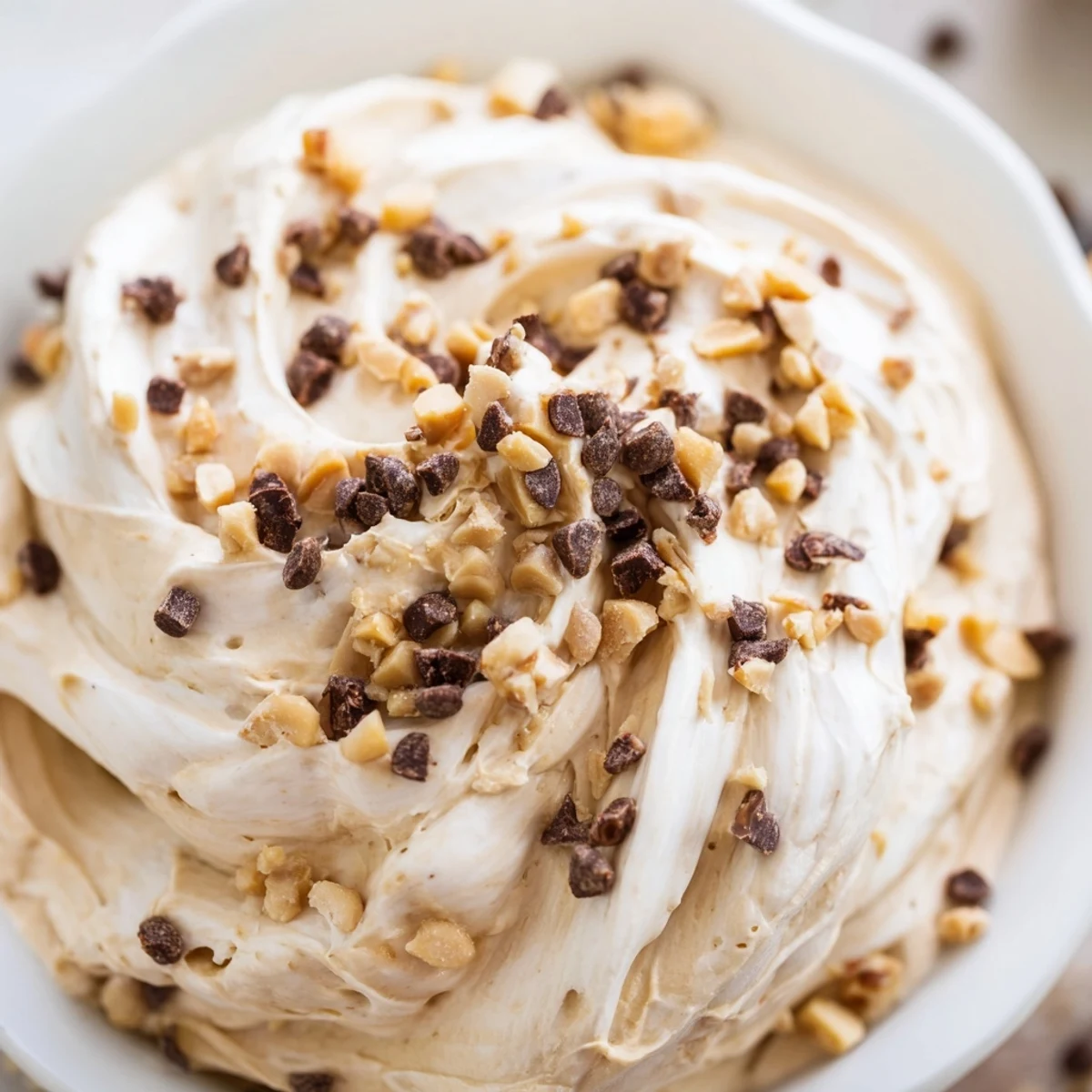 Light and fluffy peanut butter mousse swirled with Cool Whip and garnished with mini chocolate chips