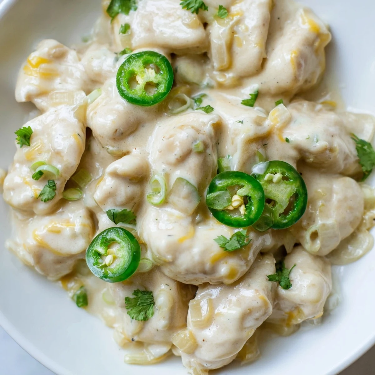 Spicy jalapeno chicken breasts smothered in rich cream sauce with tender sliced peppers