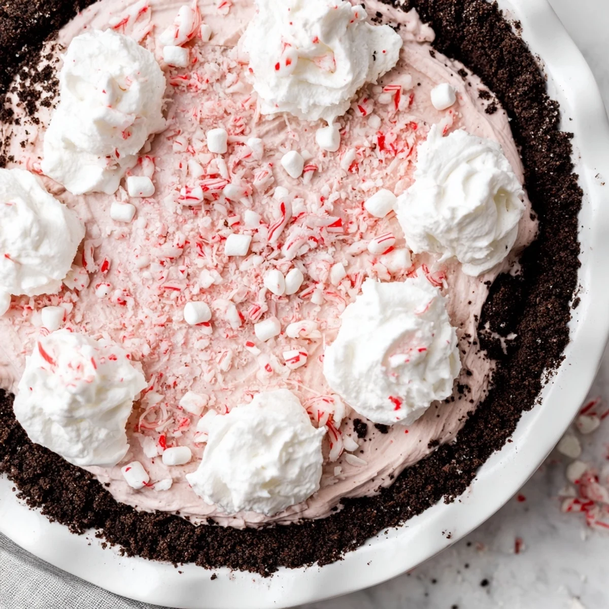 Candy Cane Pie with creamy peppermint filling, chocolate crust, crushed candy canes