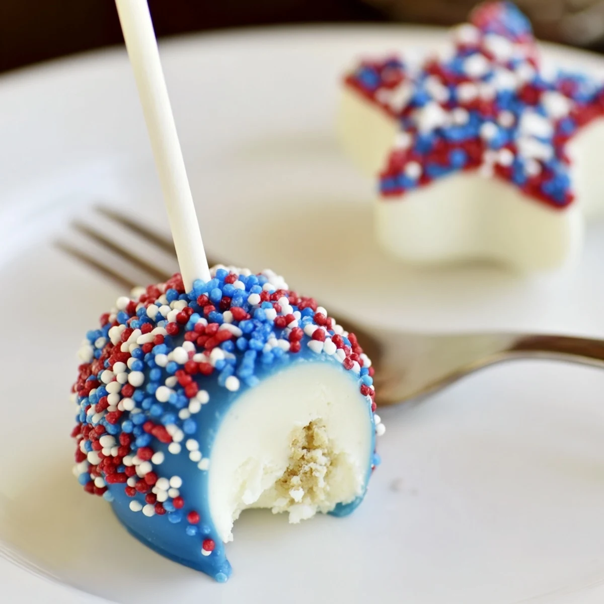 Stacked Fourth Of July Star Cheesecake Pops, tangy cream cheese with sprinkle crunch