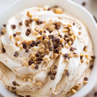 Light and fluffy peanut butter mousse swirled with Cool Whip and garnished with mini chocolate chips