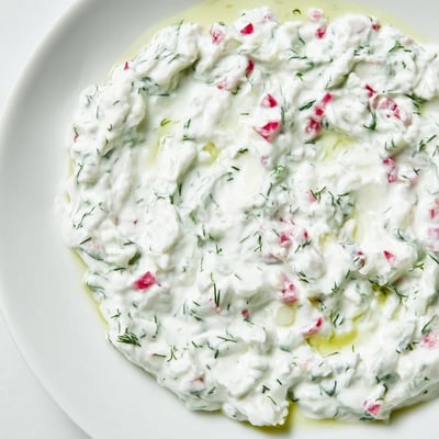 Crisp grated radishes folded into Greek yogurt for a refreshing Mediterranean appetizer